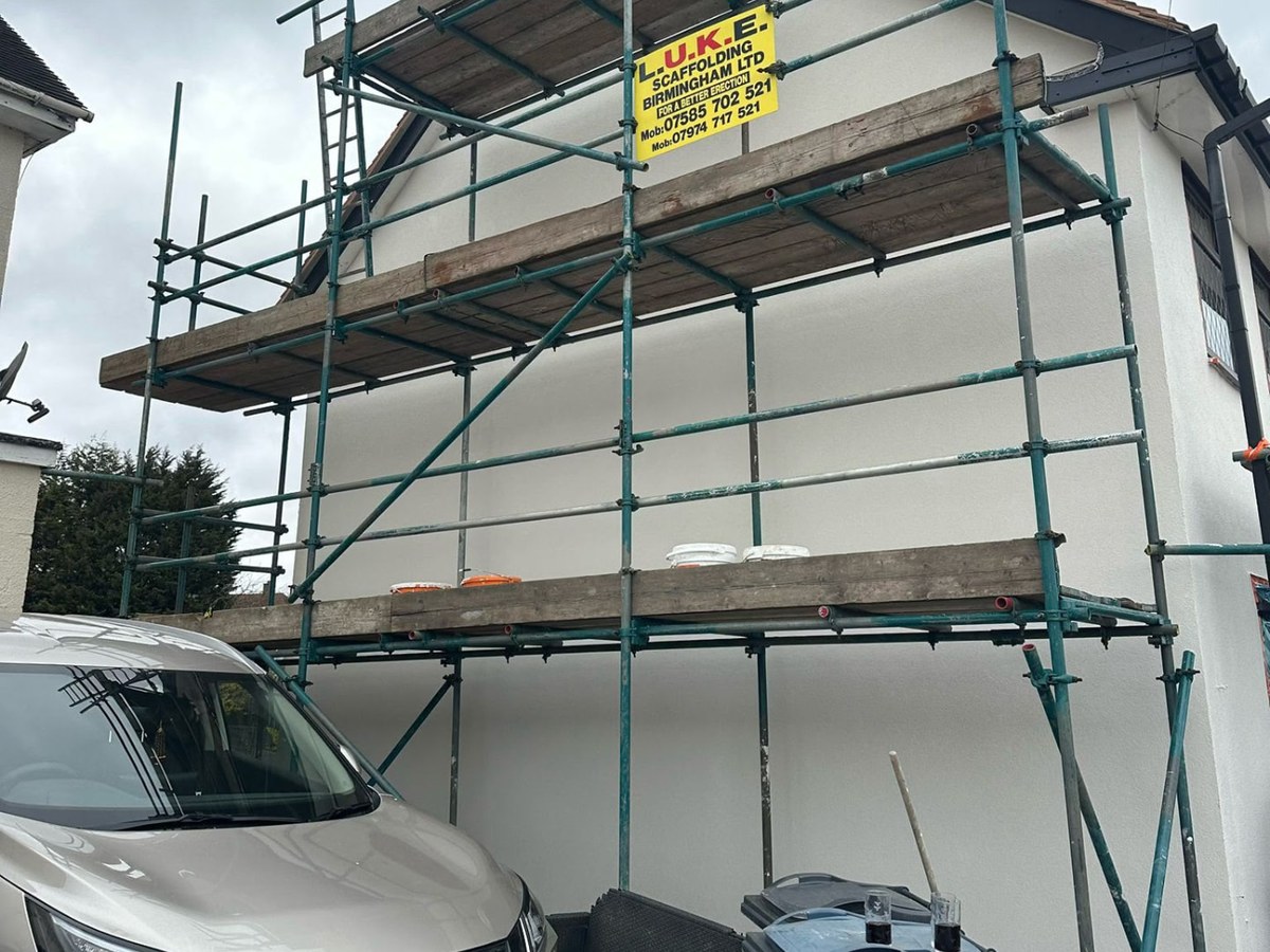 The same gable end after re-rendering in a smooth white silicone finish